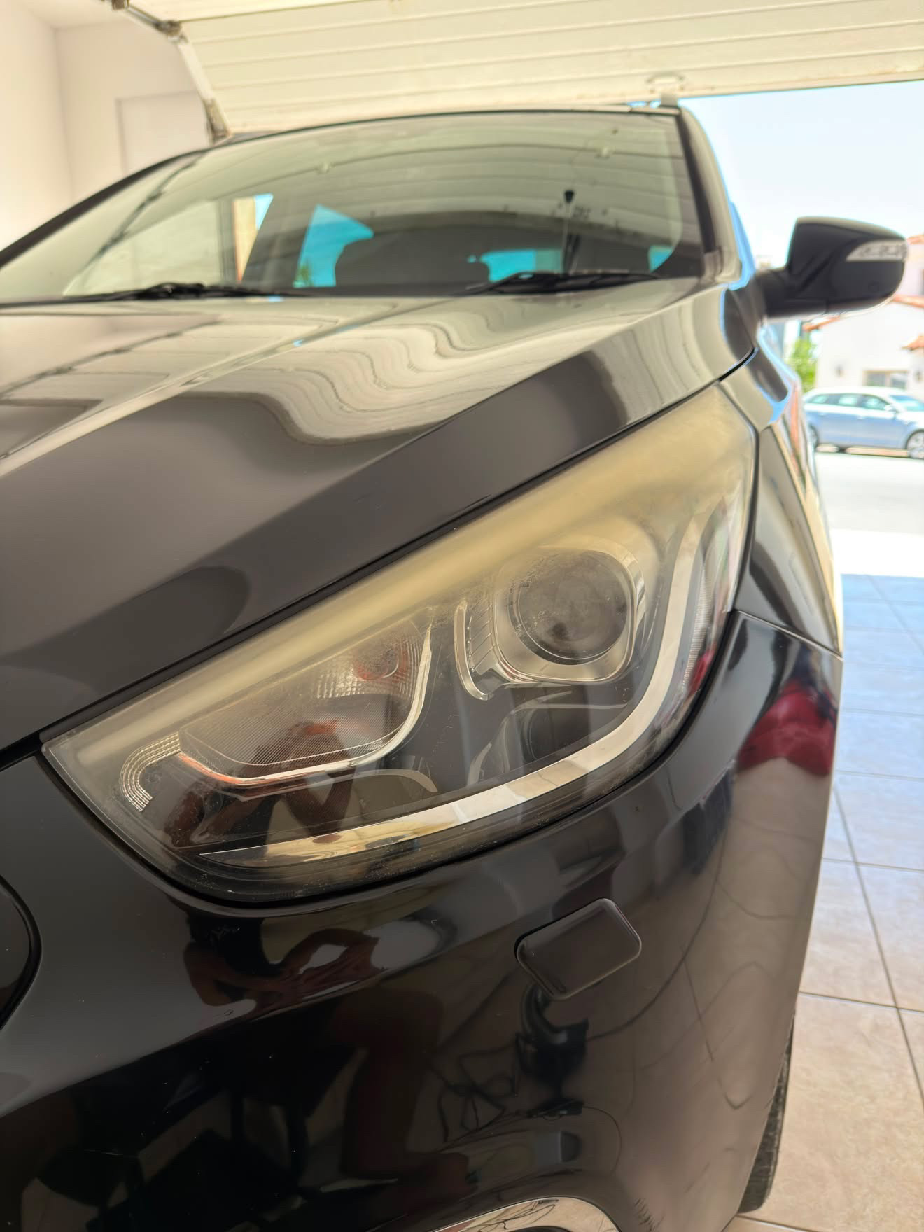 Hazy, yellowed headlight lens before restoration, PG Detailing