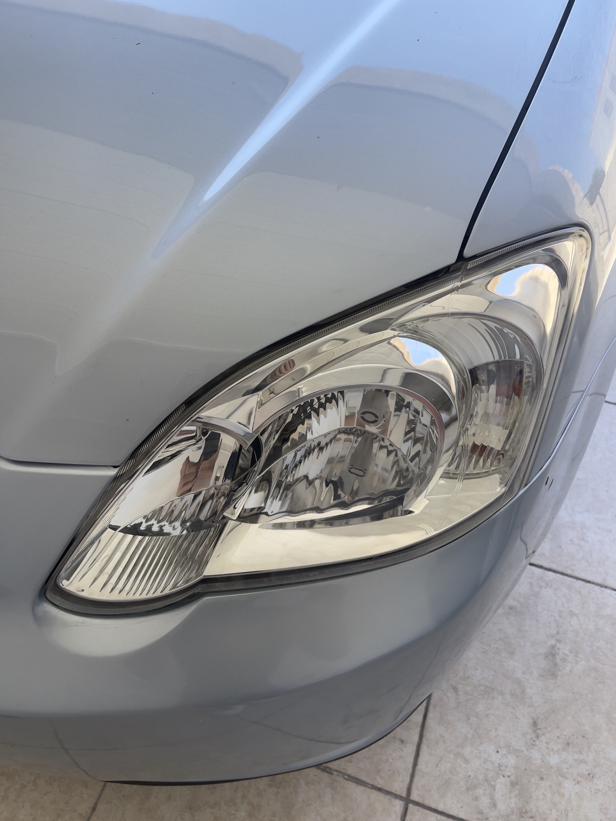 Restored clear headlight lens after wet-sanding and polish
